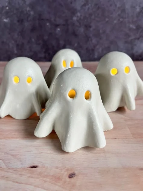Cute ghost decor idea 4: Set Out Ceramic Ghost Tealights With Fiery Eyes