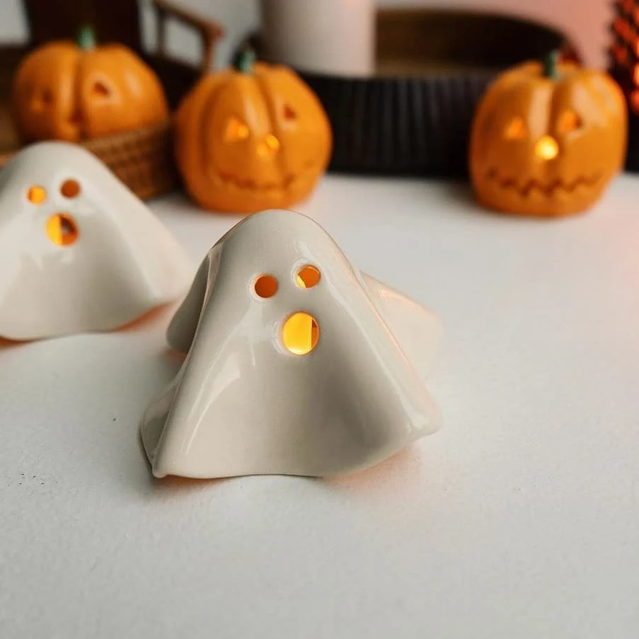 Cute ghost decor idea 9: Light Ceramic Ghosts Beside Mini Pumpkin Lanterns
