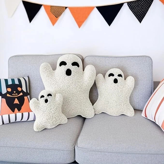 Cute ghost decor idea 16: Pile Ghost Throw Pillows on the Couch
