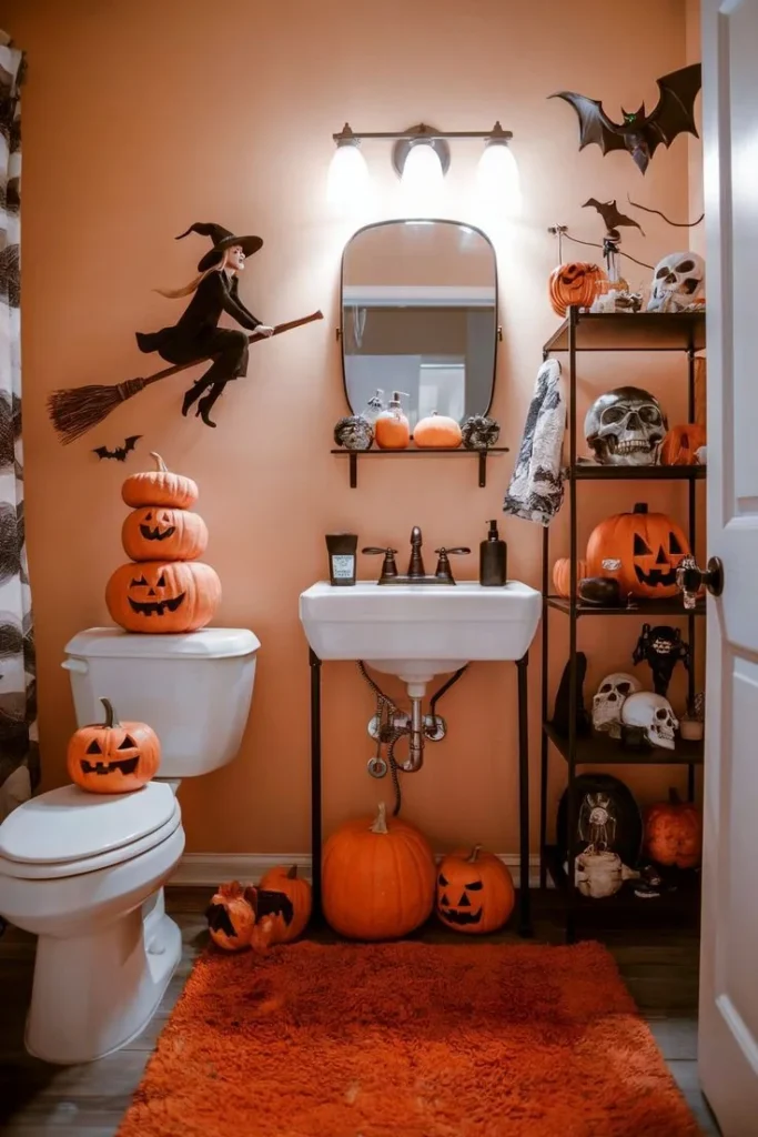 Halloween bathroom decorating idea 19: Stack Jack o Lanterns on the Tank in a Peach Powder Room