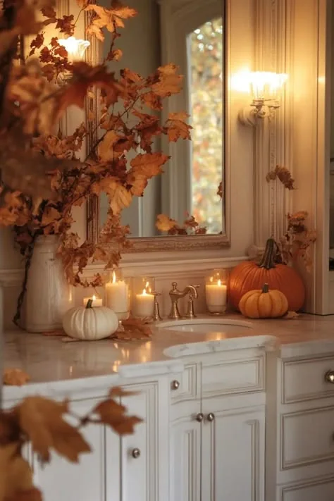 Halloween bathroom decorating idea 23: Lean Into Harvest With Fall Leaves, Pumpkins, and Candles