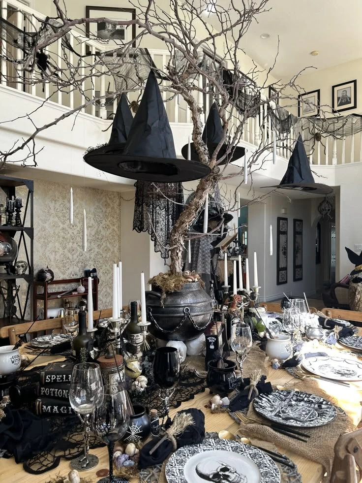 Halloween tablescape idea 14: Hang Witch Hats Above the Table Like a Spell in Progress
