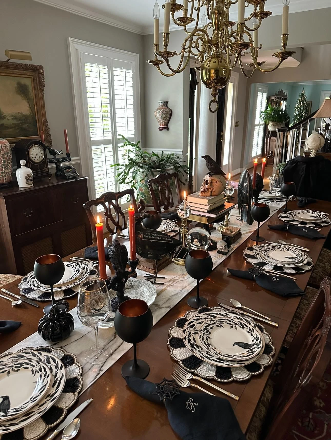 Halloween tablescape idea 16: Build a Harvest Buffet With a Crow and Skull Topper