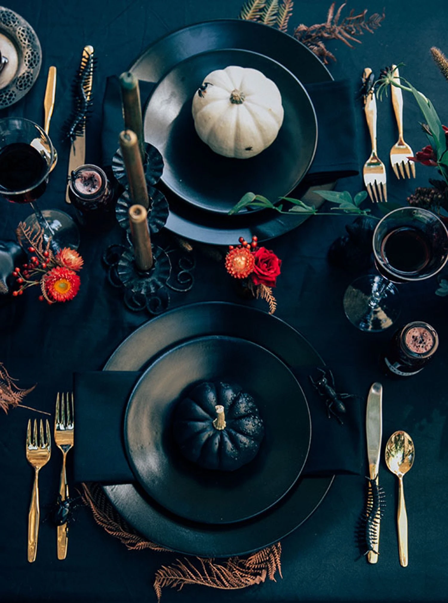 Halloween tablescape idea 19: Keep Place Settings Dark With One Pale Pumpkin