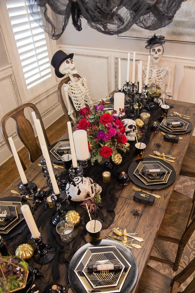 Halloween tablescape idea 23: Keep It Monochrome: Black Plates, White Bones