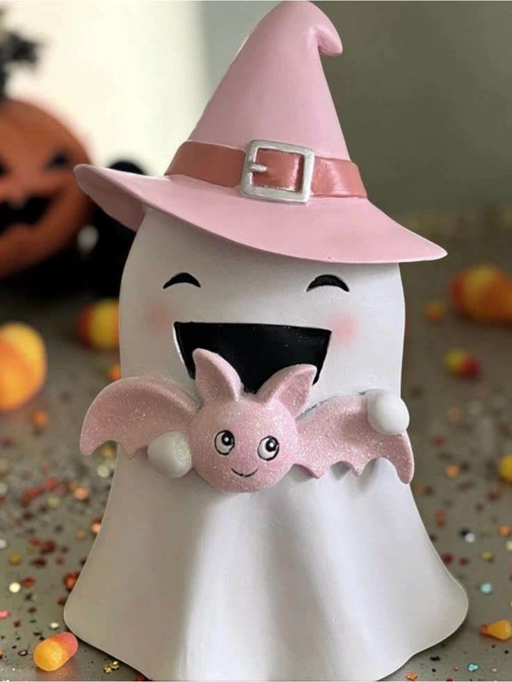 Pink Halloween decor idea 11: Sit a Witch-Hat Ghost on the Bookshelf