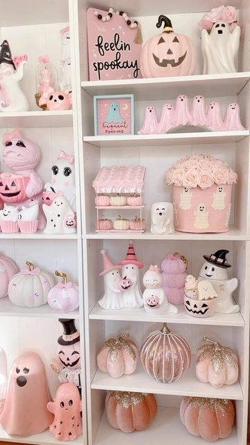 Pink Halloween decor idea 14: Fill One Shelf With Pink Ghosts and Pumpkins