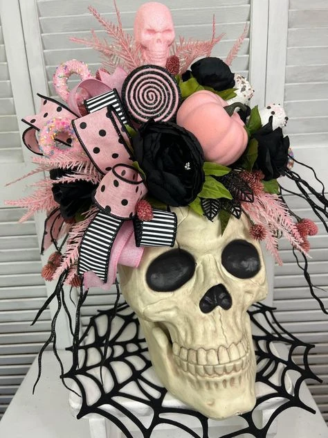 Pink Halloween decor idea 23: Fill a Skull Vase With Pink Blooms