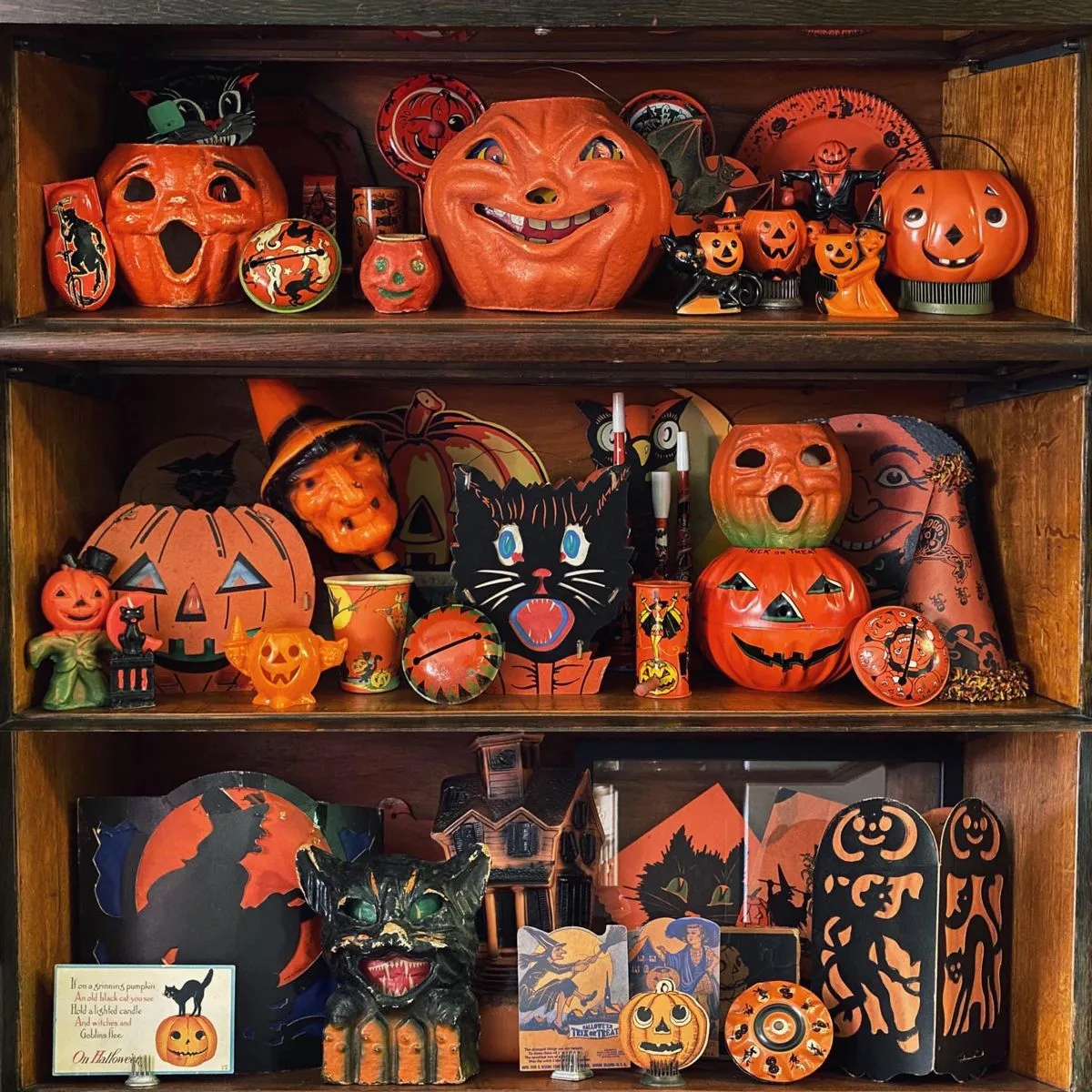 Vintage Halloween decor idea 8: Style Dark Wood Shelves With Retro Jack-o'-Lanterns