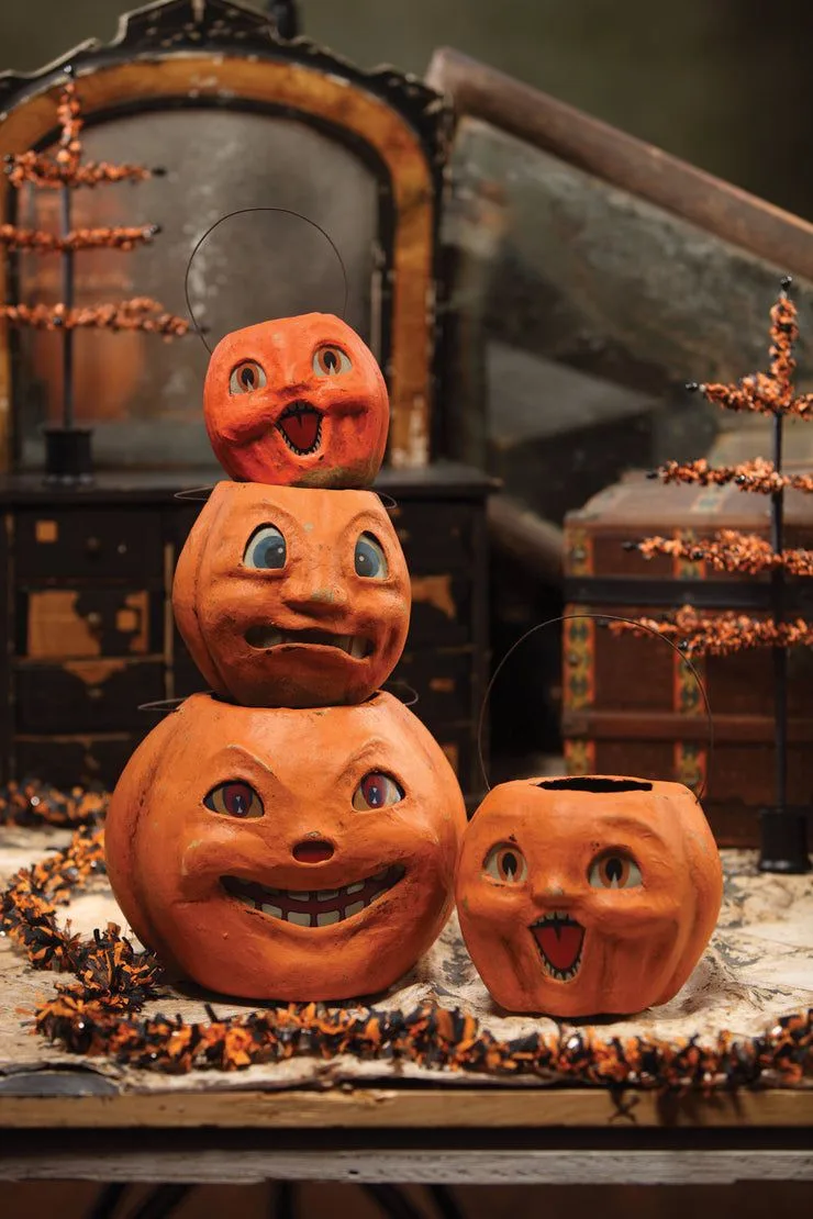 Vintage Halloween decor idea 10: Stack Vintage-Look Pumpkins Into a Totem