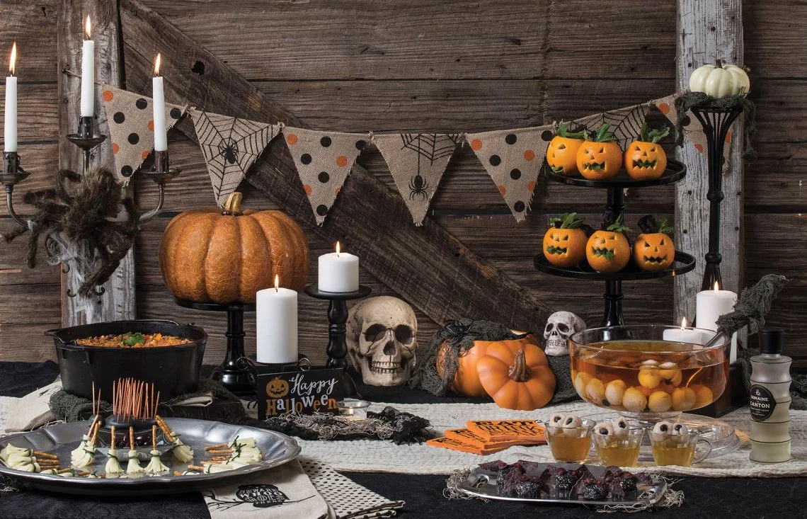 Vintage Halloween decor idea 14: Set a Candlelit Vintage Table With Skulls and Bunting